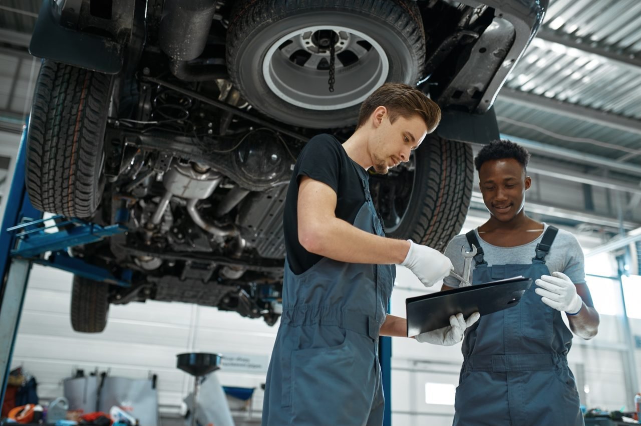 male-mechanics-looking-on-checklist-car-service.jpg